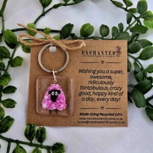 Keyring with a handpainted pink sheep on it