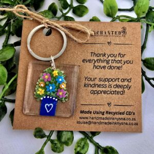 Keyring with a handpainted flower bush in a pot on it.